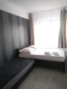 Кровать или кровати в номере Apartament Pogodny