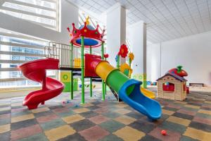 a childrens play area with slides and a playground at Frank Porter - Mon Reve in Dubai