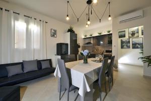 a living room with a table and a couch at Casa Calari 2 in Casa Calari