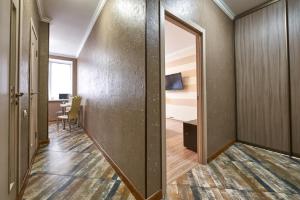a hallway with a door leading to a room at PaulMarie Apartments on Mira 25B in Mogilev
