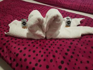 a pair of towels on a bed with polka dots at Ferienwohnung im Mühlbachtal in Miehlen +9 photos