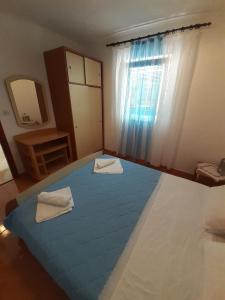 Posteľ alebo postele v izbe v ubytovaní Apartments Slavica