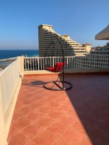 a swing on the roof of a building at Penthouse Three-Bedroom Villa in Porto Sokhna Family only in Ain Sokhna