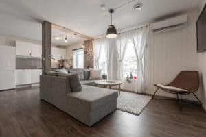 a living room with a couch and a table at SAGI 4 PRIVATE APARTMENT in Hafslo
