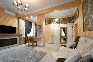 a living room with a couch and a fireplace at PaulMarie Apartments on Prs. Lenina, 19 in Gomel