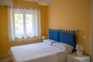 A bed or beds in a room at Residence l'Ogliastro