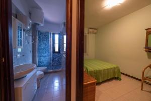 A bed or beds in a room at Residence l'Ogliastro