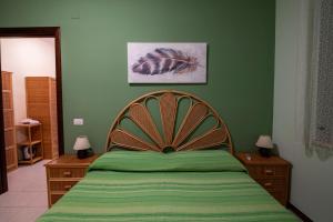 A bed or beds in a room at Residence l'Ogliastro