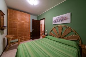 A bed or beds in a room at Residence l'Ogliastro