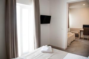 Postel nebo postele na pokoji v ubytování Hotel Solemare - Frontemare - 3 Stelle Superior