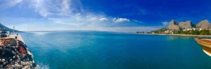 a view of a large body of water with a boat at Sunrise Studio Apartments 3 in Lokva Rogoznica