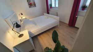 A bed or beds in a room at Le Monde Apartment Bratislava - amazing 5BDR in downtown