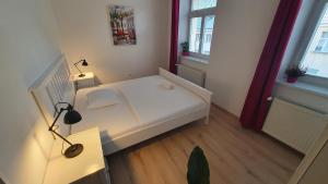 A bed or beds in a room at Le Monde Apartment Bratislava - amazing 5BDR in downtown