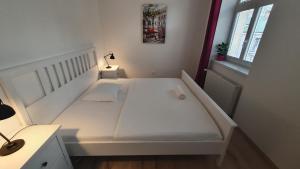 A bed or beds in a room at Le Monde Apartment Bratislava - amazing 5BDR in downtown