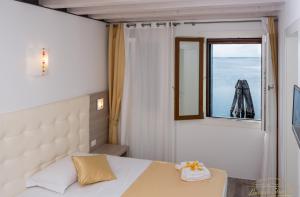 Cama ou camas em um quarto em Locanda Stravedo