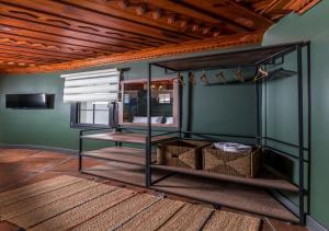 a room with green walls and a wooden ceiling at Sunset Hotel Marmaris in Marmaris