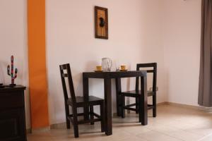 a small table and two chairs in a room at Jujuy-preyungas in San Salvador de Jujuy