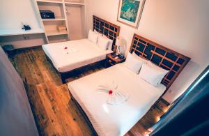 Postel nebo postele na pokoji v ubytování La Placita Inn + 29 fotografií