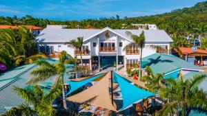 an aerial view of a house with a swimming pool at La Placita Inn in West Bay