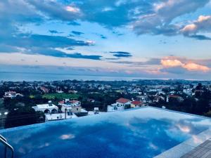 a swimming pool with a view of a city at Spectacular Villa In Kyrenia in Kyrenia