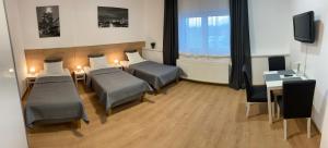 Postel nebo postele na pokoji v ubytování Frýdecká Apartments