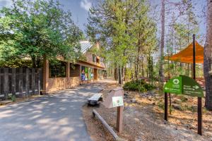 a house with a sign in front of a building at Fairway Village 28 | Discover Sunriver in Sunriver