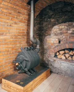 a stone oven with a brick wall at Latron 98 in Český Krumlov