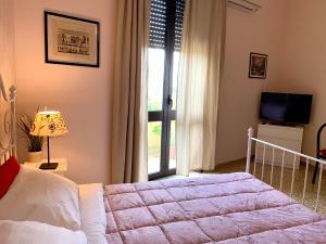 Postel nebo postele na pokoji v ubytování Luna Piena B&B
