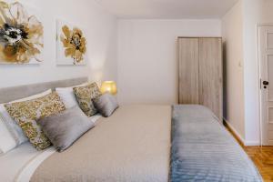 Postel nebo postele na pokoji v ubytování Mumadona Apartment