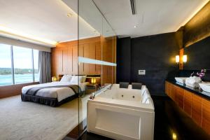 Voodi või voodid majutusasutuse Horizon Hotel toas
