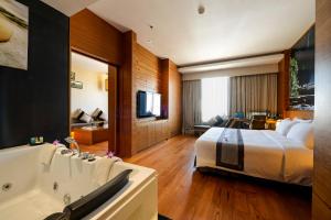 Voodi või voodid majutusasutuse Horizon Hotel toas