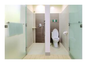 a bathroom with a toilet and a shower at Go Hotels Ortigas Center in Manila