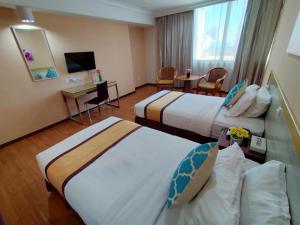Postel nebo postele na pokoji v ubytování TD Plaza Hotel + 37 fotografií