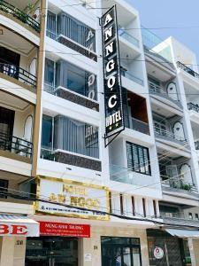a hotel sign on the side of a building at AN NGỌC HOTEL in Can Tho