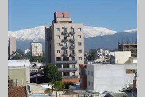 a tall building with balconies on top of a city at Departamento Ohiggins I in Salta