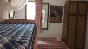 Un pat sau paturi într-o cameră la Alba Luz