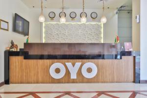 an ovo store with clocks on the wall at OYO 367 Eureka Hotel in Dubai