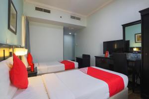 Postel nebo postele na pokoji v ubytování Eureka Hotel