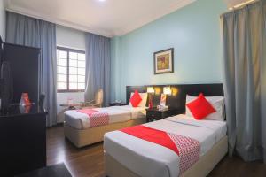 Postel nebo postele na pokoji v ubytování Eureka Hotel