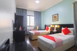 Postel nebo postele na pokoji v ubytování Eureka Hotel