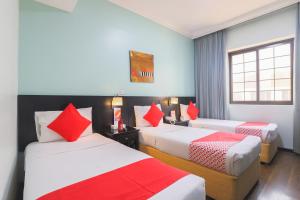 Postel nebo postele na pokoji v ubytování Eureka Hotel