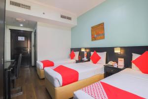 Postel nebo postele na pokoji v ubytování Eureka Hotel