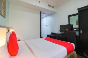 Postel nebo postele na pokoji v ubytování Eureka Hotel