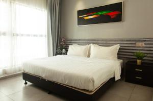 Postel nebo postele na pokoji v ubytování M Design Hotel @ Shamelin Perkasa