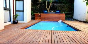 a small swimming pool on a wooden deck at Sovereign Paradise - Unit 22 in KwaDukuza