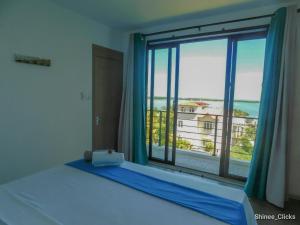 Ένα ή περισσότερα κρεβάτια σε δωμάτιο στο Fullmoon Apartment & Studio