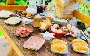 a table with different types of food on it at MY HOUSE in Batumi