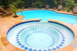 a large swimming pool in a resort at Romantic Beach Villas in General Luna