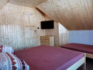 Postel nebo postele na pokoji v ubytování Chata Osmička