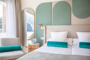 Postel nebo postele na pokoji v ubytování Grupotel Molins